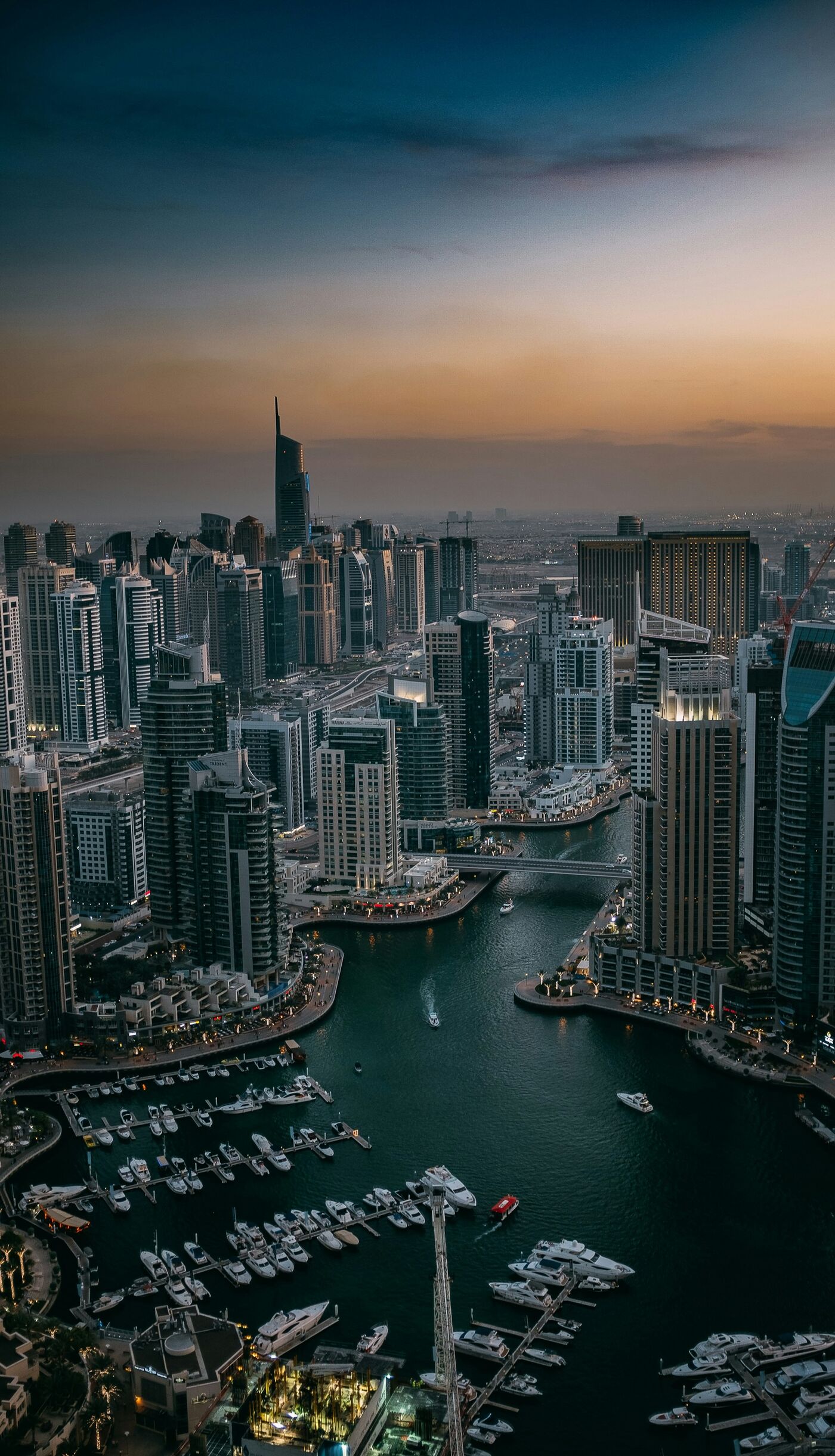 Dubai Marina at dusk, the towers lit and the berths quiet