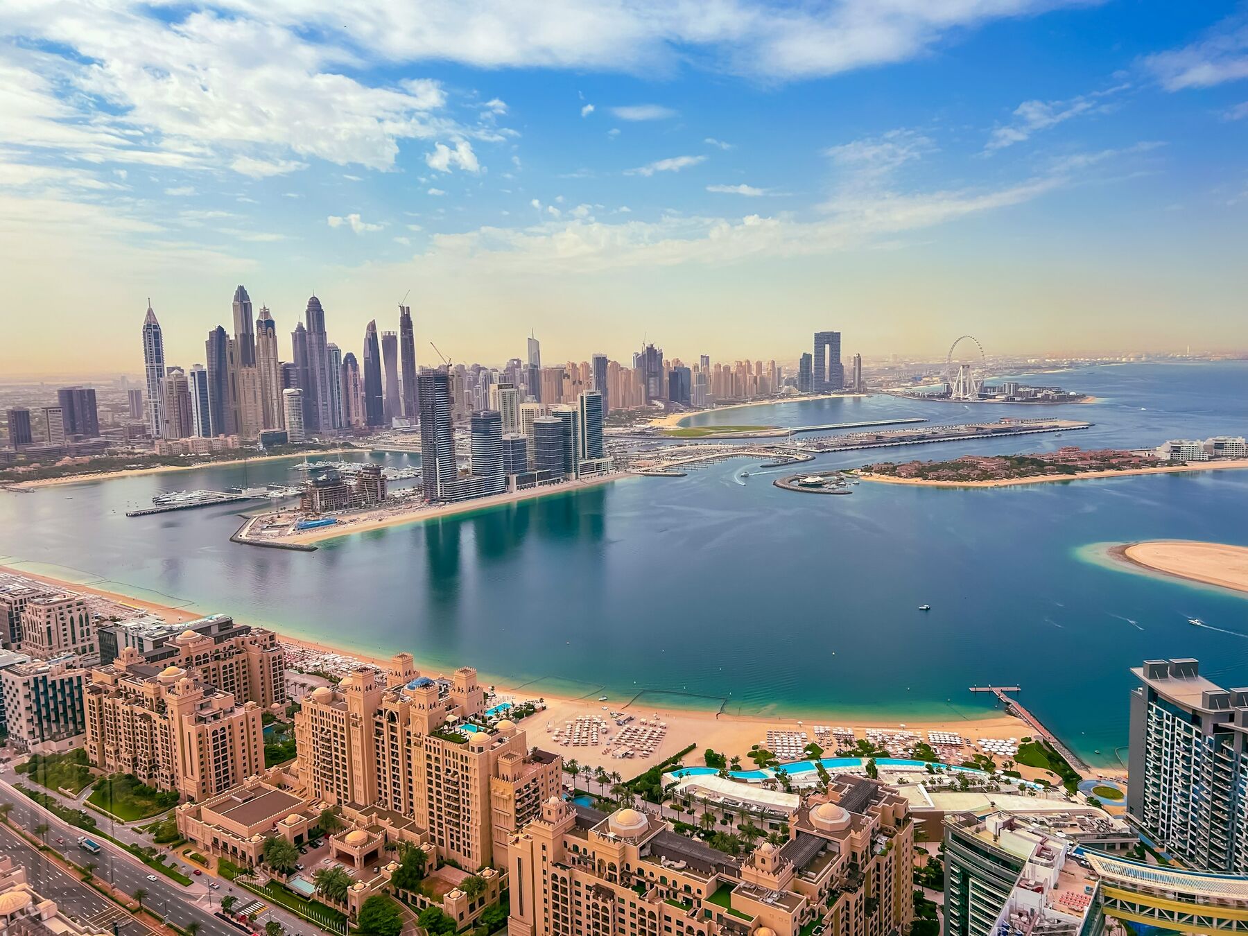 The Palm Jumeirah and the Dubai coastline from the air, the water we sail